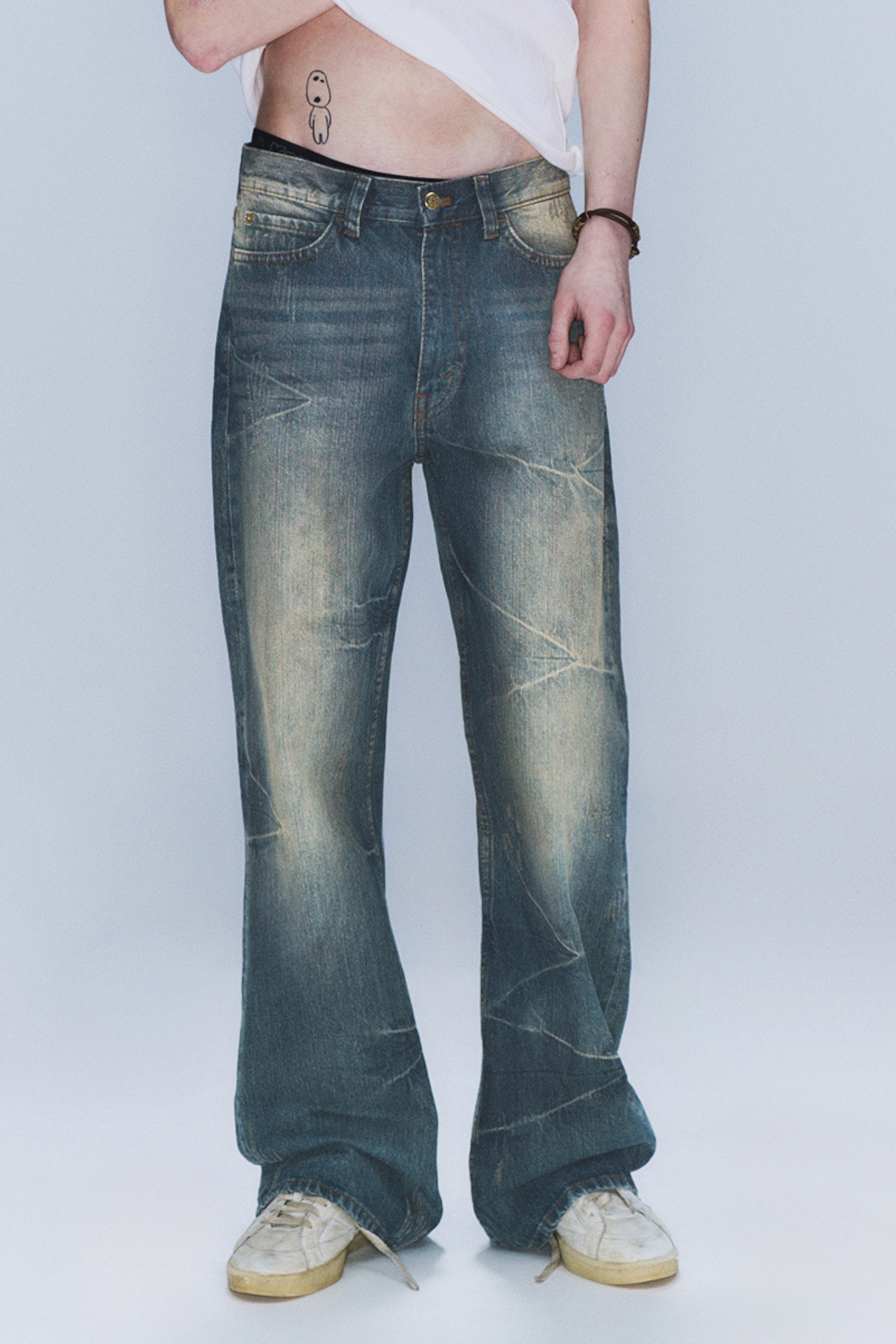 Model wearing a pair of boo bootleg cheap monday jeans