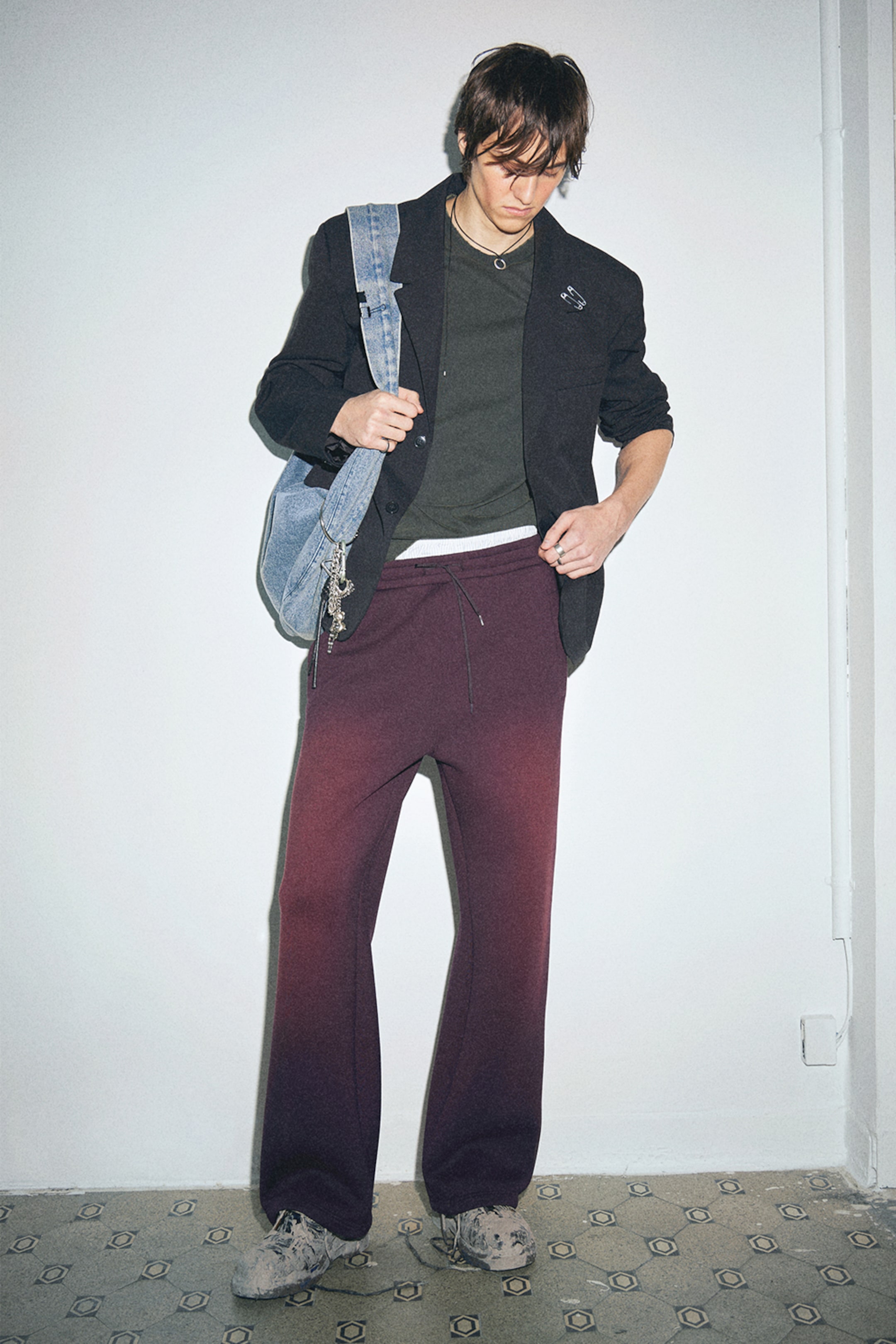 Model wearing a pair of Scuba Sweatpants from the Weekday 2025 collection