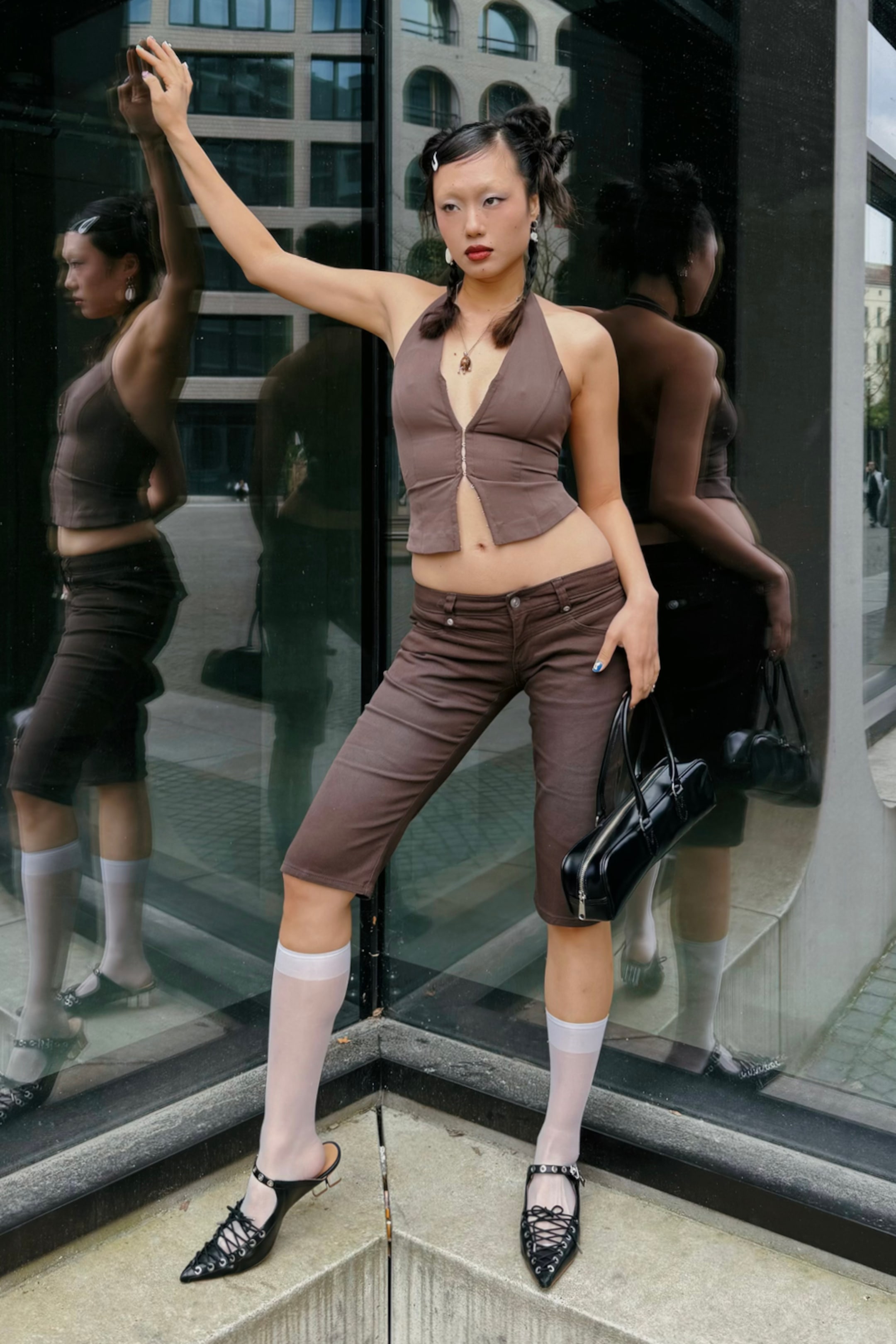 A girl wearing a short brown top