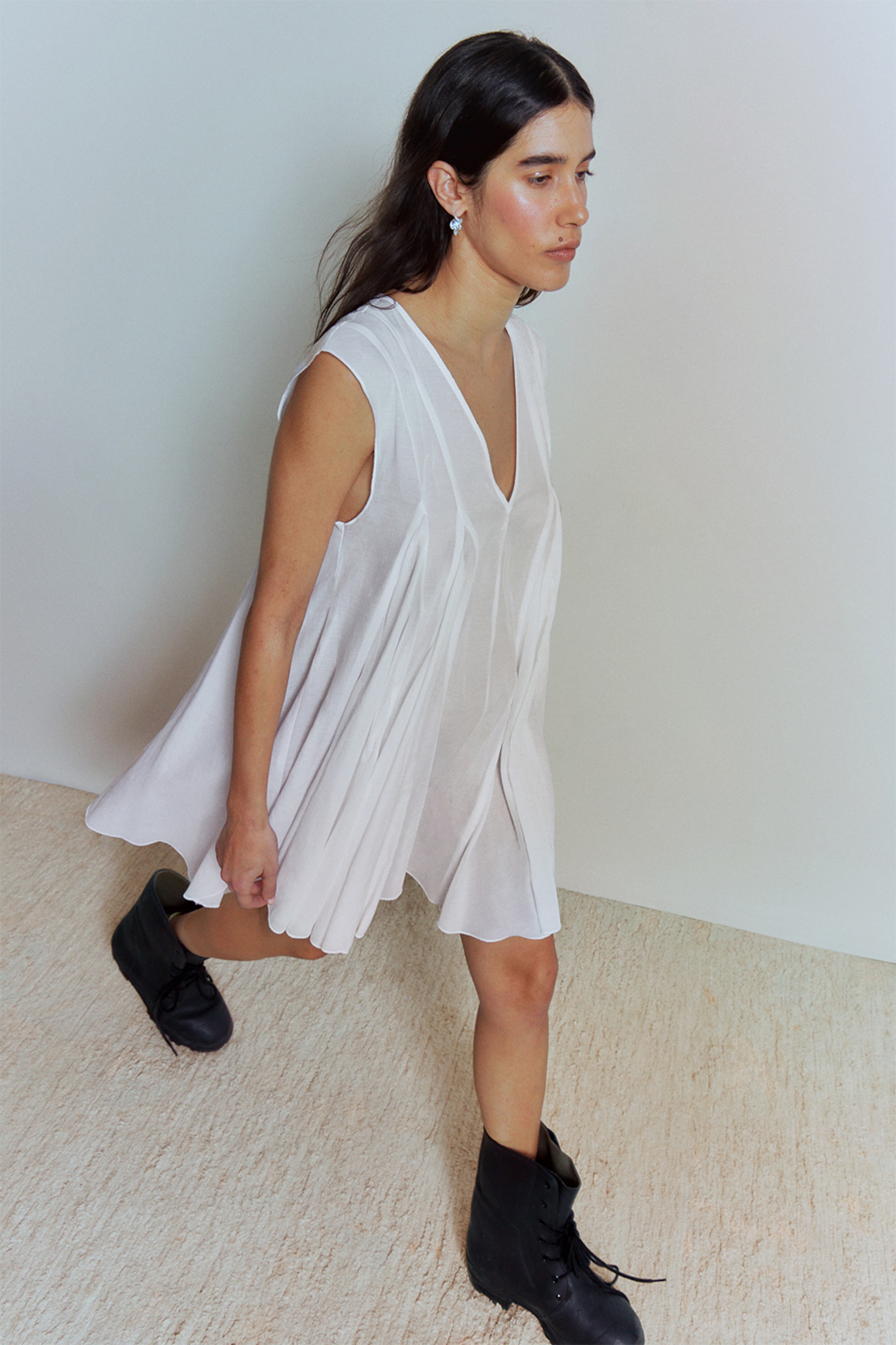 A woman wearing an outfit from the Weekday 2025 collection