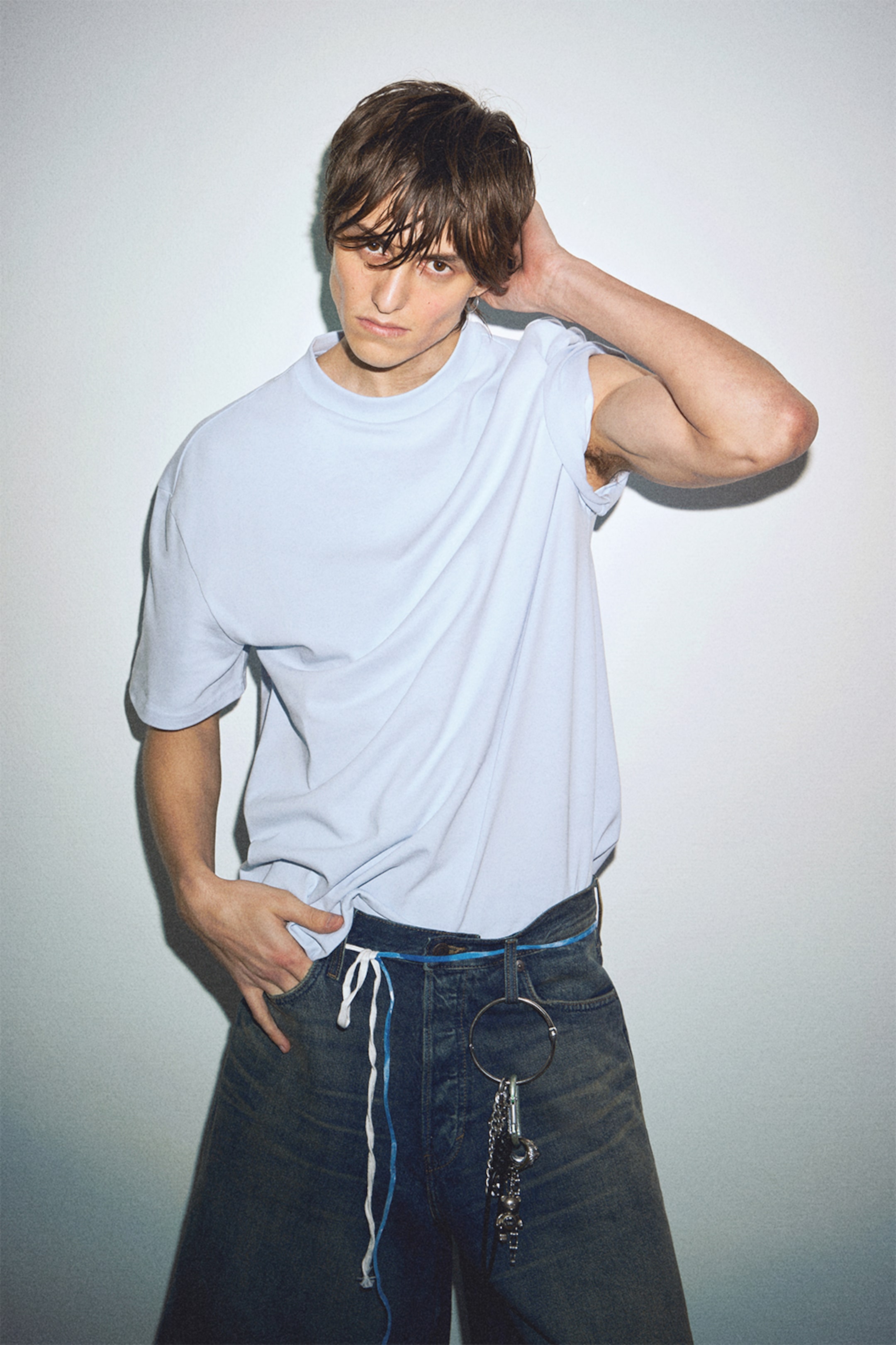 Model wearing a blue t-shirt from the Weekday 2025 collection