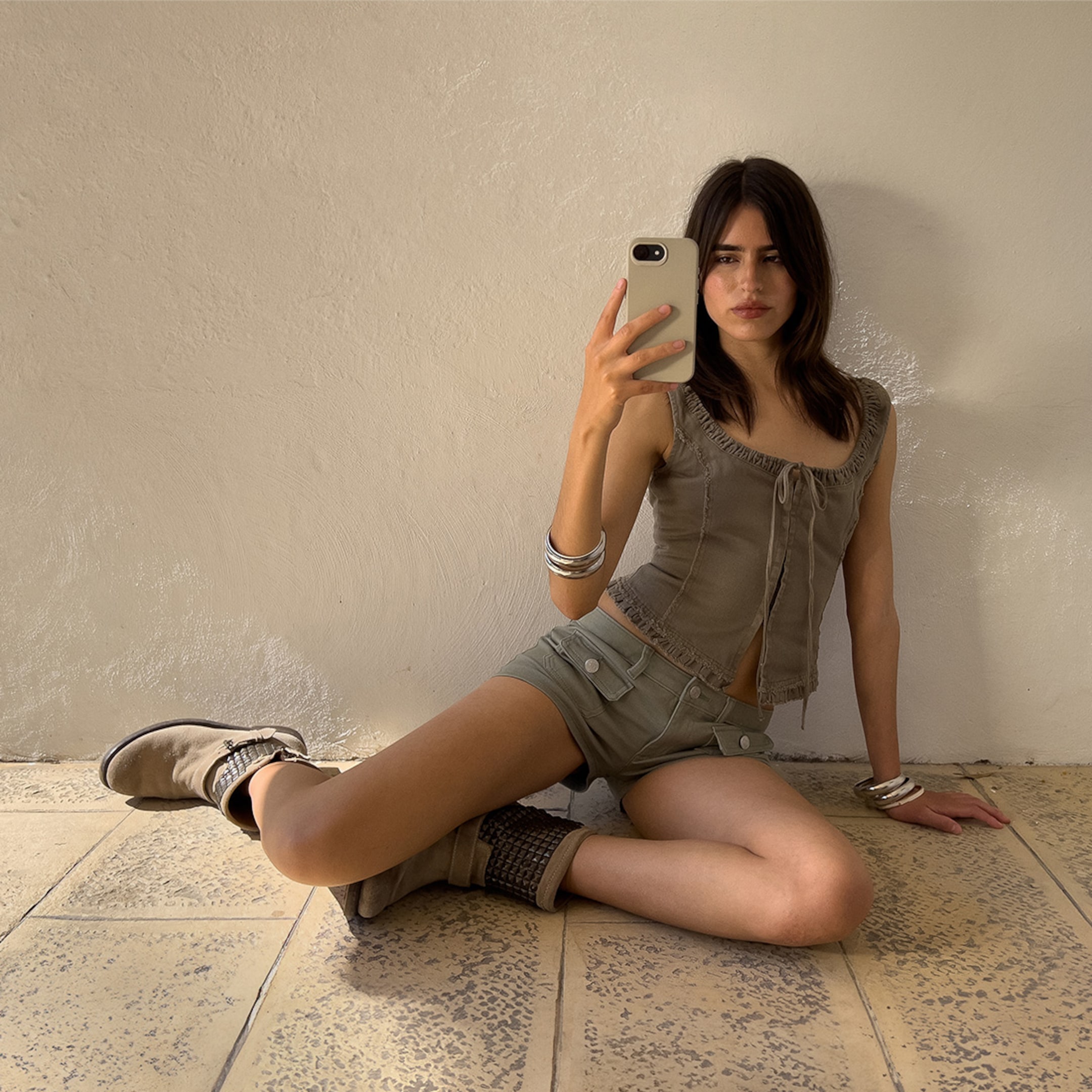 A woman wearing khaki set