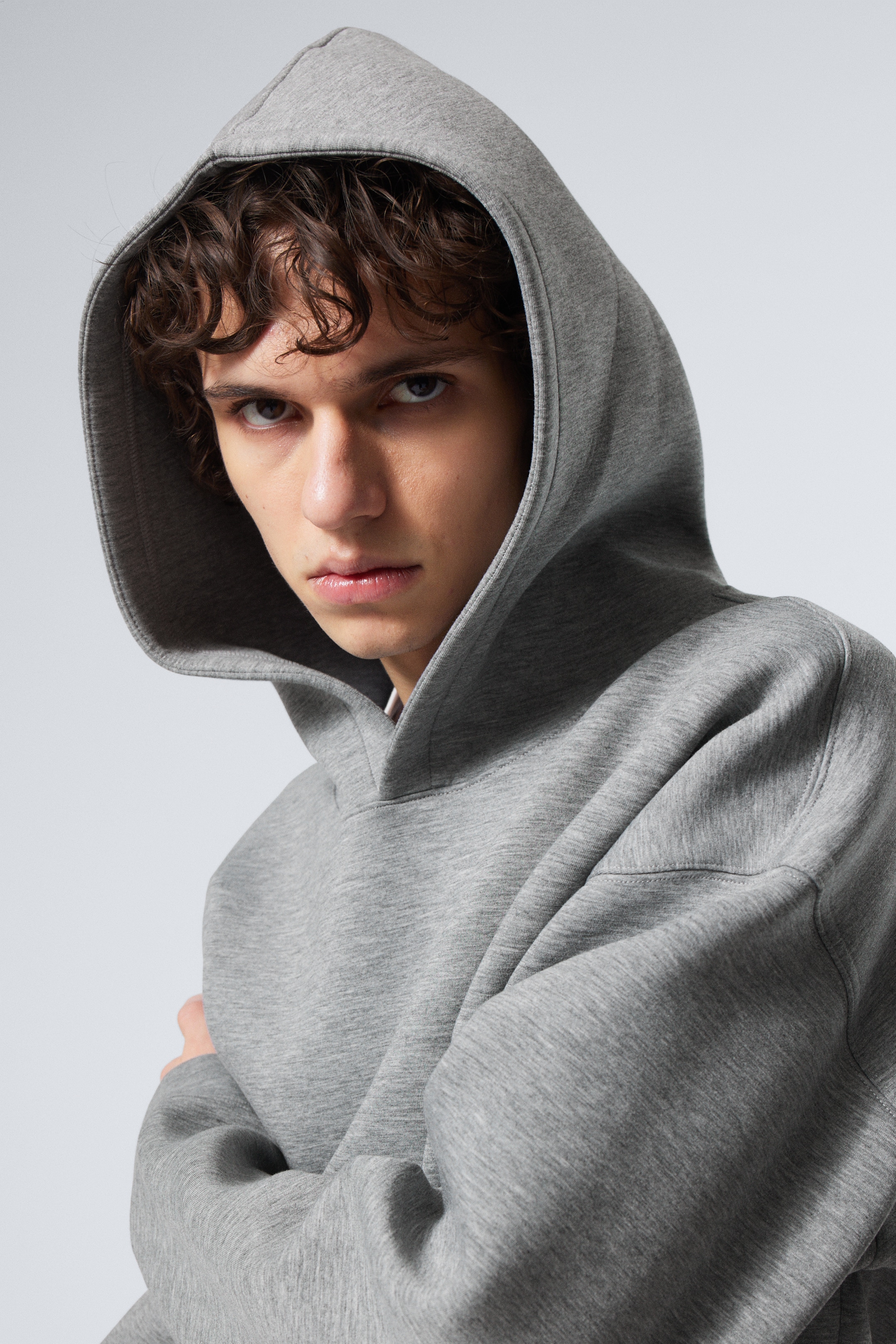 Model wearing a grey simon scuba hoodie