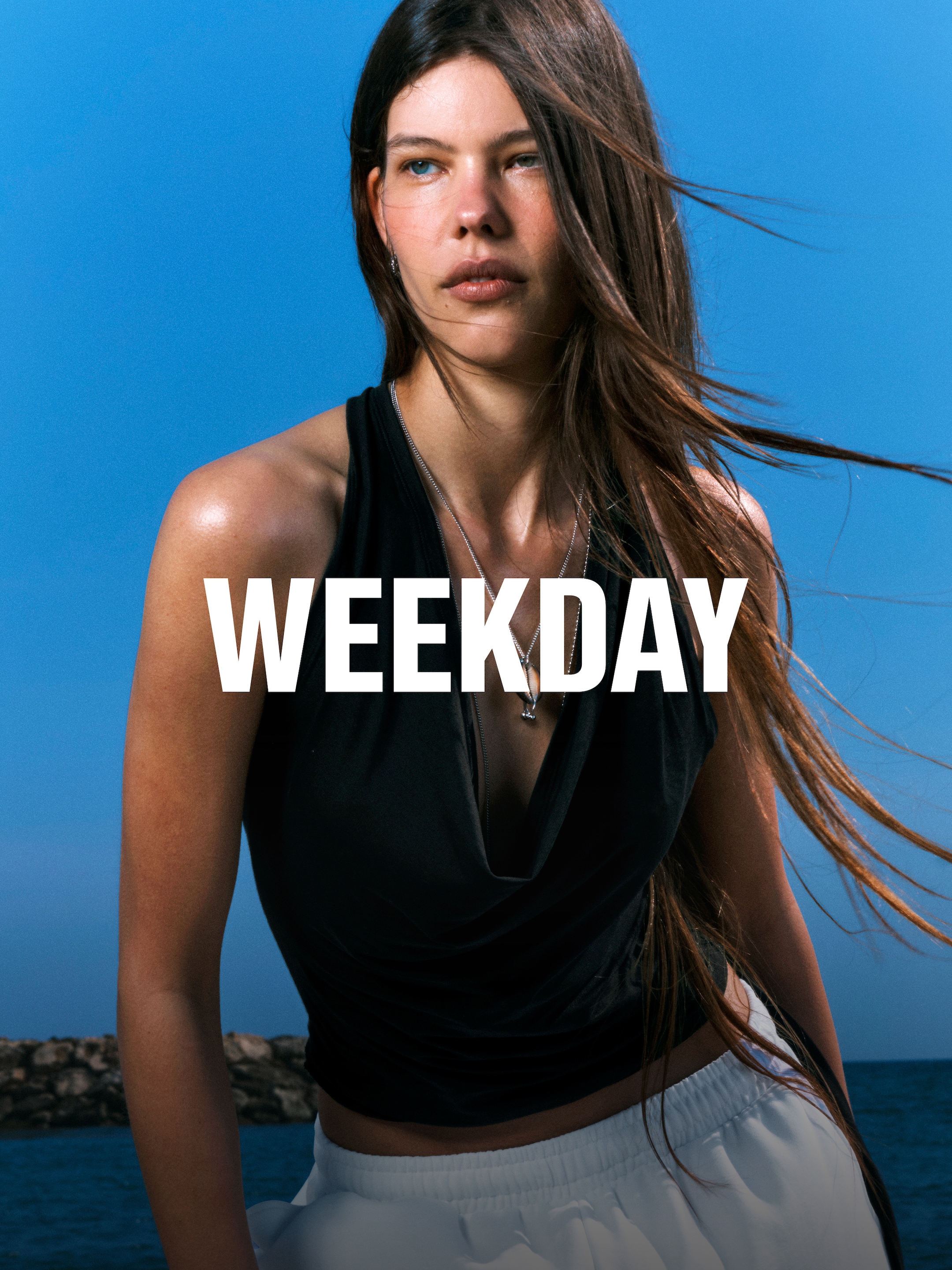 A woman wearing an outfit from Weekday collection