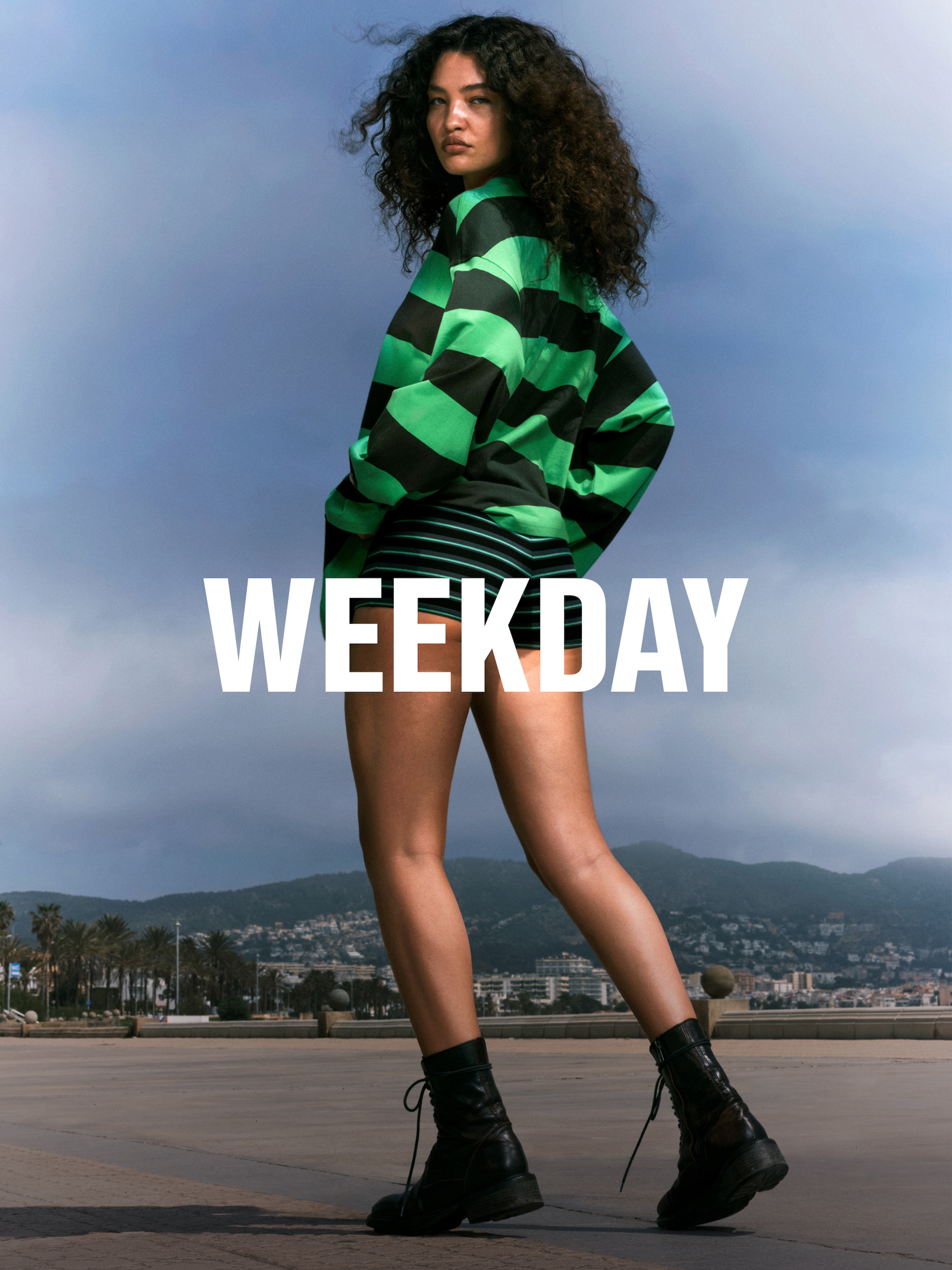 A woman wearing an outfit from Weekday collection