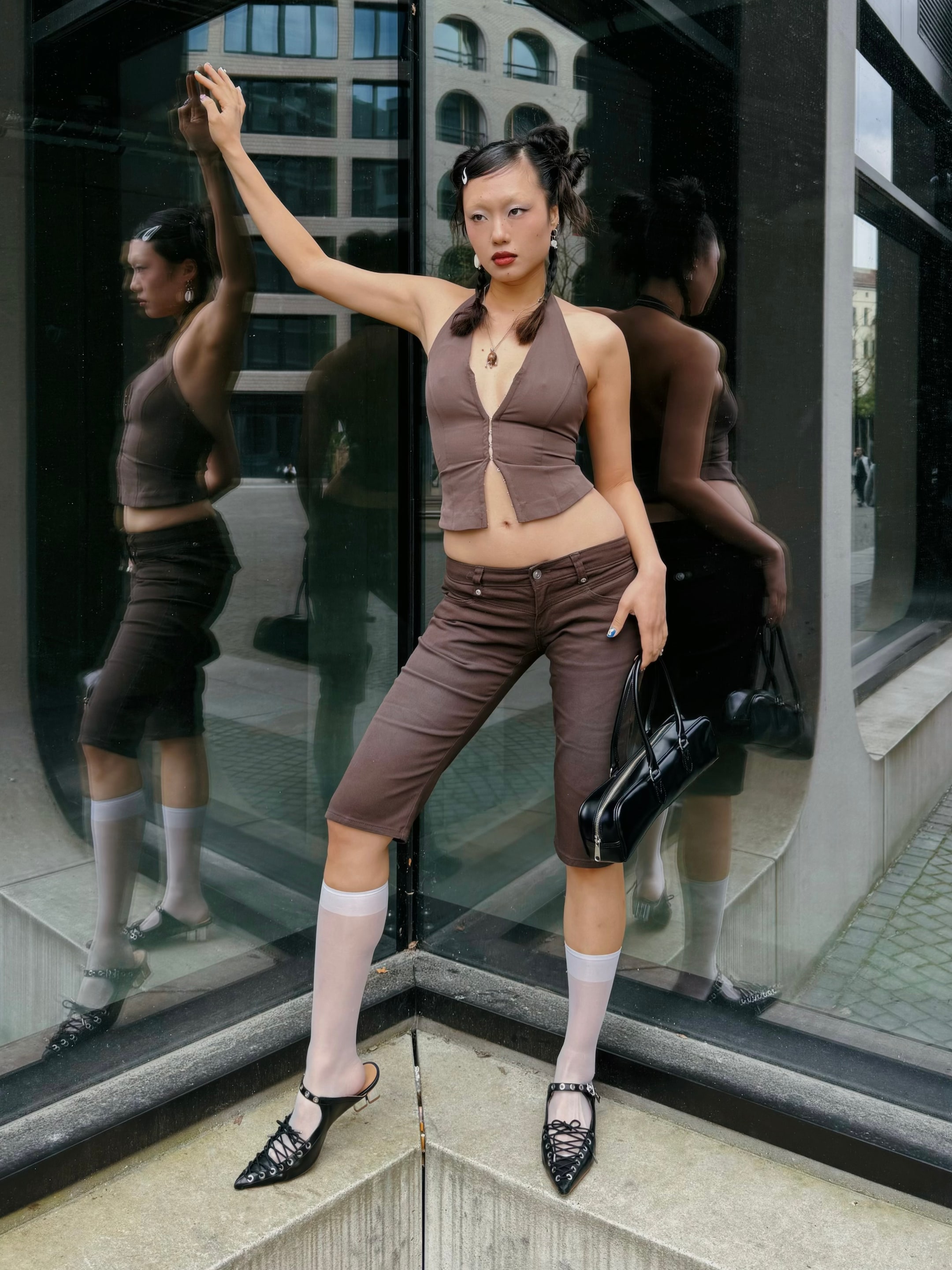 A girl wearing a short brown top